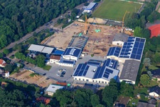 Vue aérienne de Quartier Lanzet à l'ouest avec chantier de construction des nouveaux bâtiments EDEKA Albrecht et Hagebau Kompakt - Gillet Baustoffe GmbH à Herxheim bei Landau dans le département Rhénanie-Palatinat, Allemagne