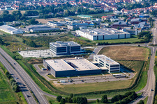 Photographie aérienne de Nouveau bâtiment - chantier de construction des bâtiments et des halls de production de l'usine Eizo GmbH dans la zone industrielle nord à Rülzheim dans le département Rhénanie-Palatinat, Allemagne