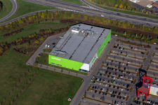 Vue aérienne de Chaise géante sur le parking du magasin de meubles - marché du meuble XXXLutz Neubert Schweinfurt dans la zone industrielle de Maintal à le quartier Oberndorf in Schweinfurt dans le département Bavière, Allemagne